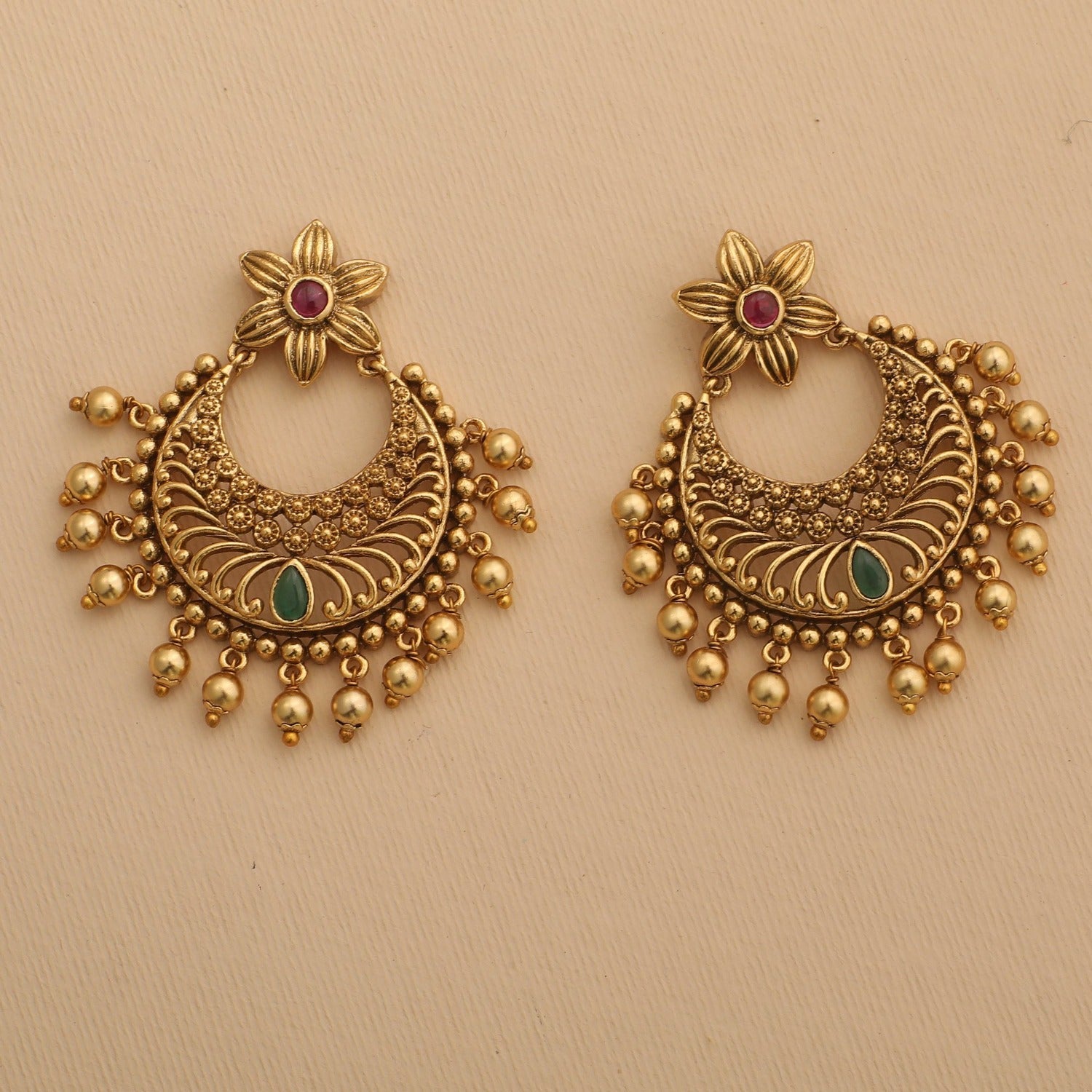 Green flower dangler antique golden earrings at ₹950 | Azilaa